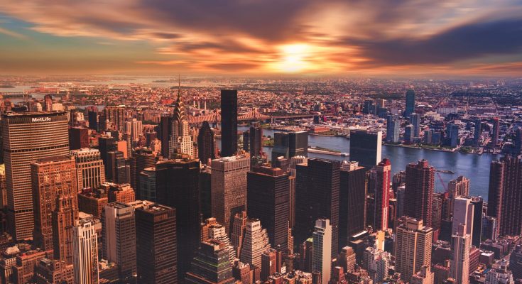 high angle view of cityscape against cloudy sky