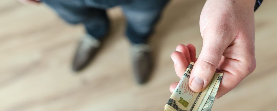 person holding banknote