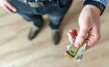 person holding banknote