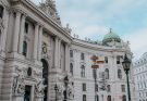 a low angle shot of a famous landmark with sculptures in the building