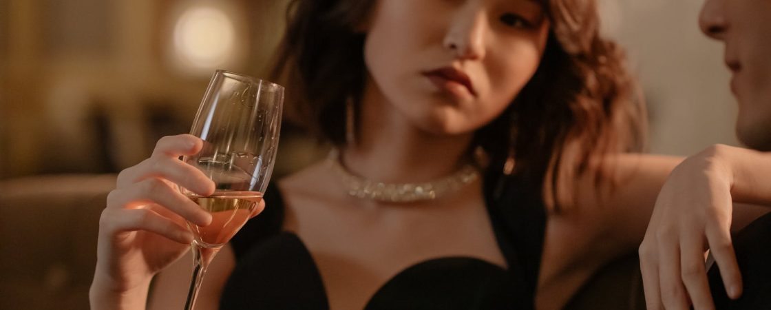 woman holding a glass of wine