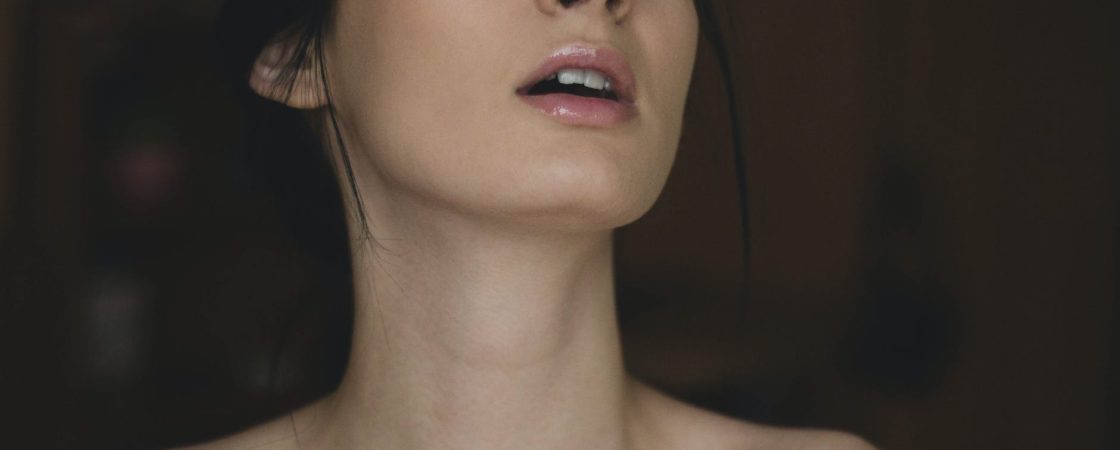 topless woman closing her eyes