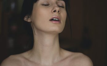 topless woman closing her eyes