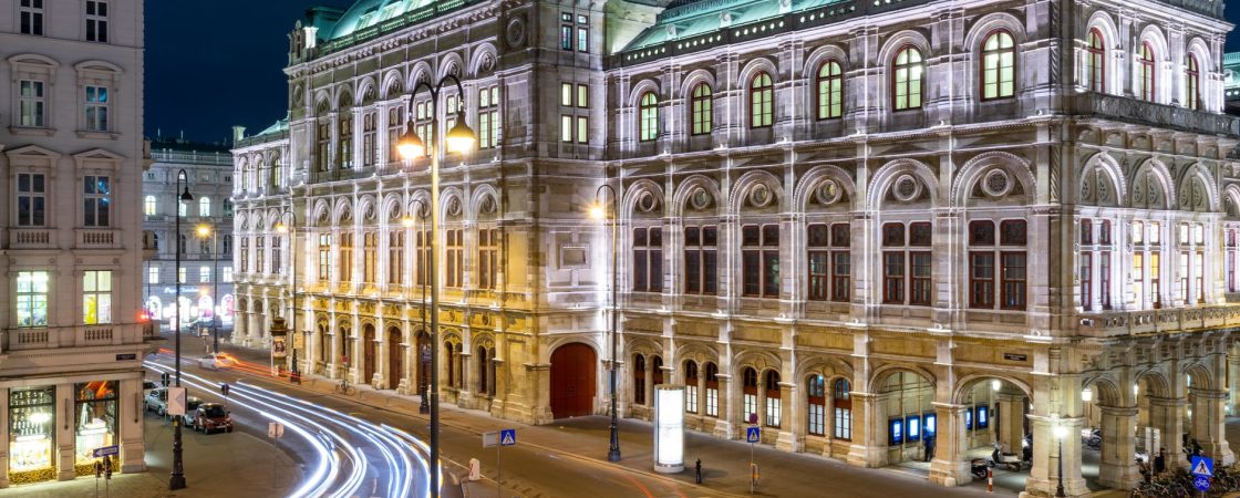 time lapse photography of cars on road near the vienna state opera in austria during night time