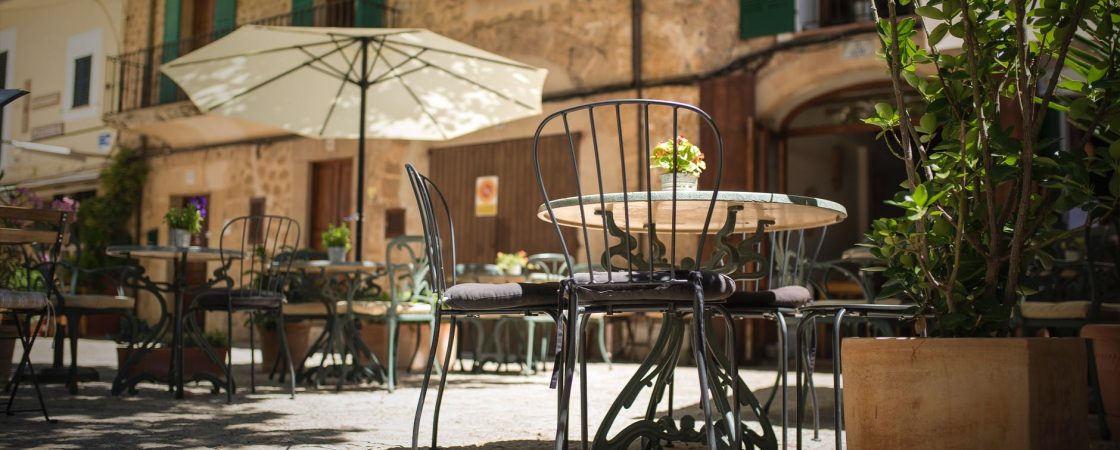 selective focus photography of table and chairs