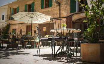 selective focus photography of table and chairs