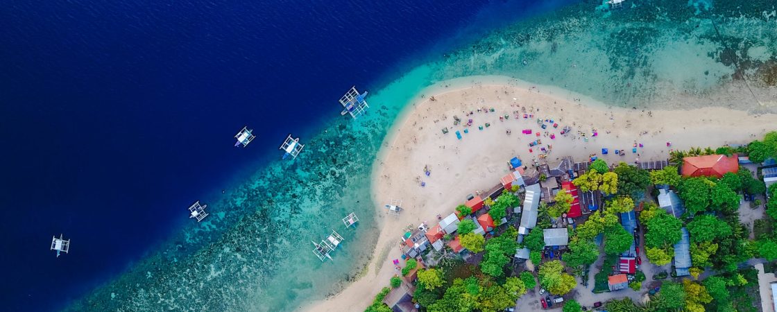 aerial view of a shore and body of water